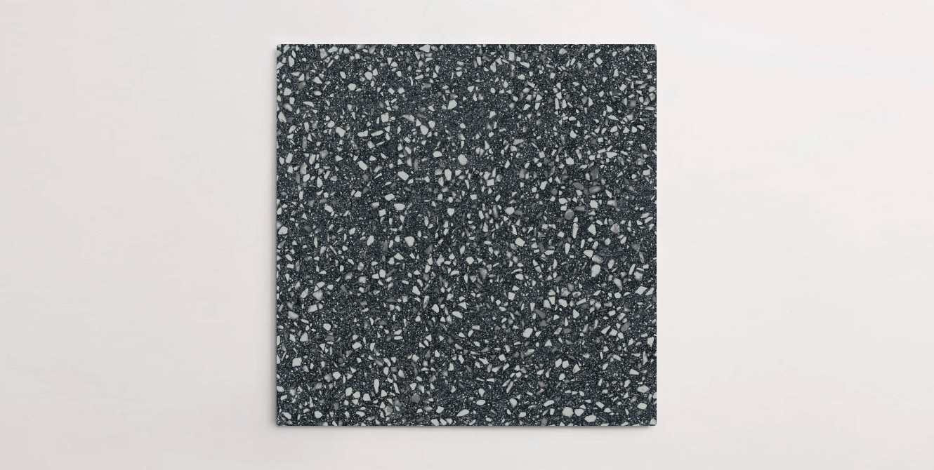 Nasco Stone + Tile's Blake Black Medium Chip terrazzo-look porcelain tile.