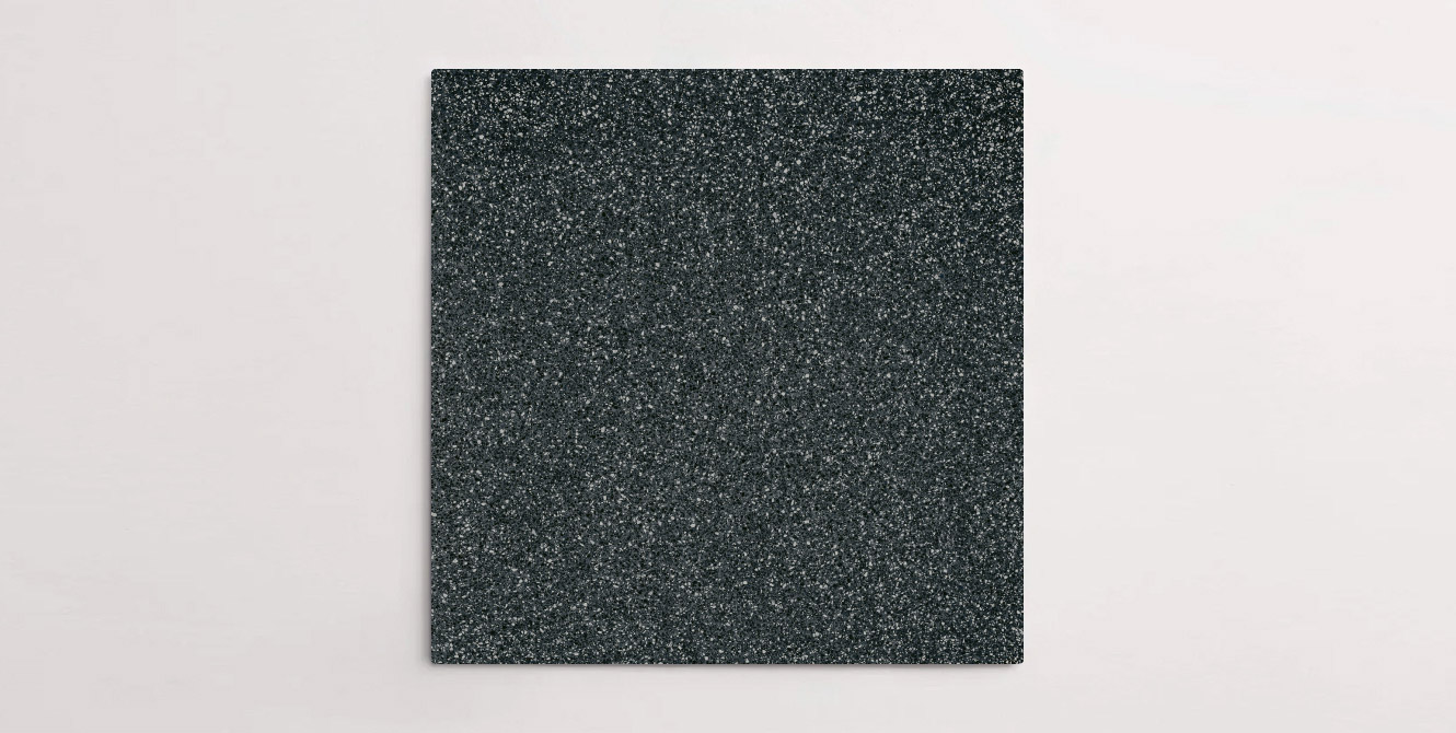 Nasco Stone + Tile's Blake Black Small Chip terrazzo-look porcelain tile.