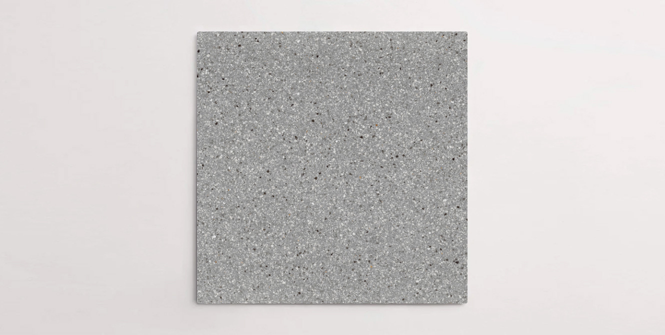 Nasco Stone + Tile's Blake Dark Grey Small Chip terrazzo-look porcelain tile.