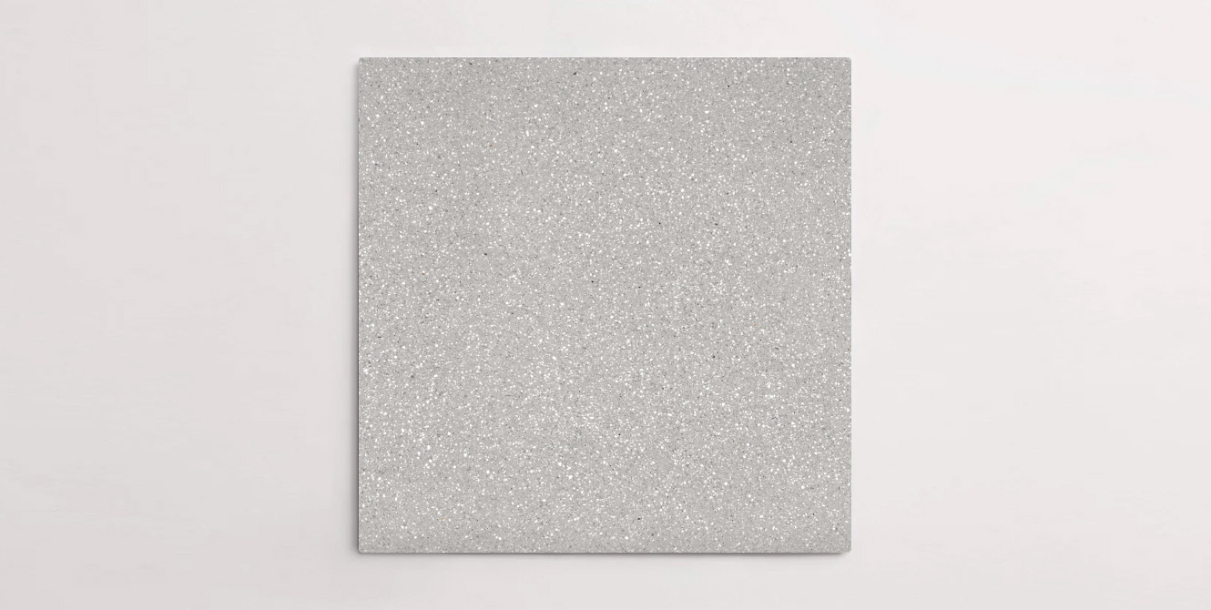 Nasco Stone + Tile's Blake Light Grey Small Chip terrazzo-look porcelain tile.