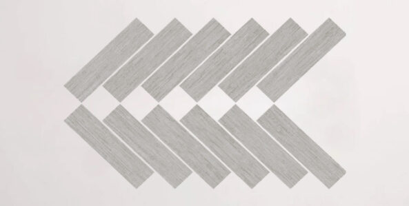 Nasco Stone + Tile Crave Light Grey Herringbone Mosaic porcelain tile.