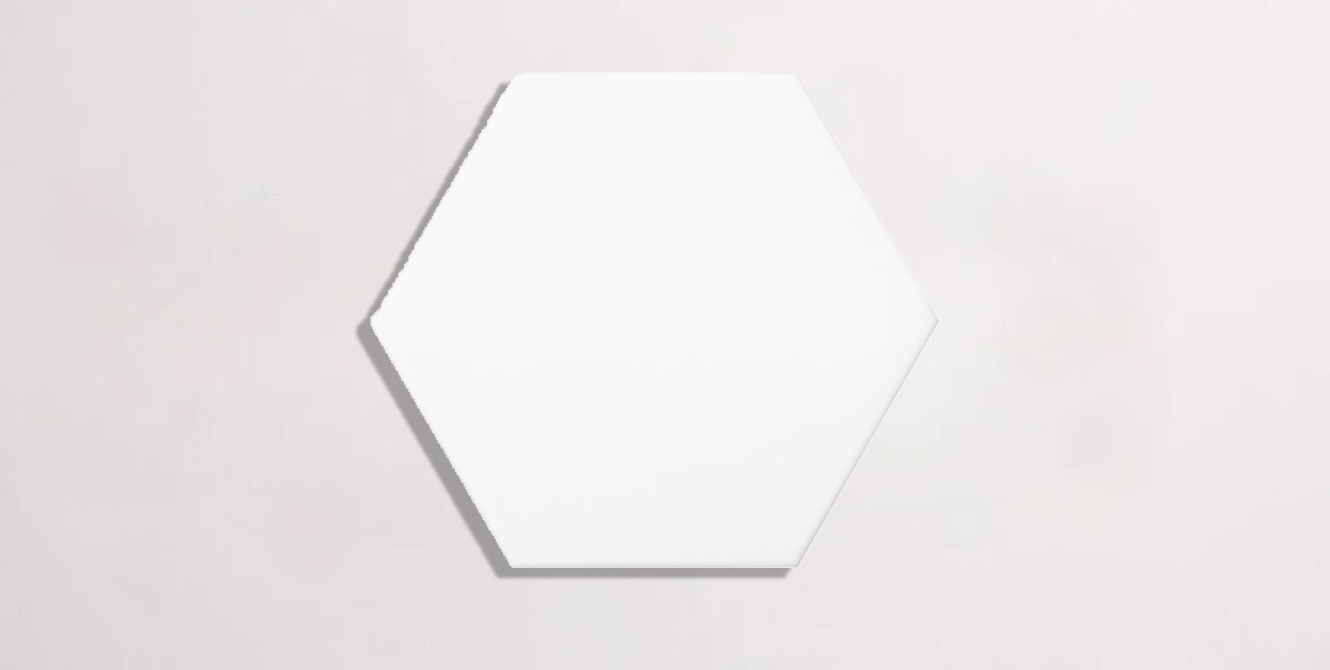 Nasco Stone + Tile Unicolor Extreme White hexagon porcelain tile.