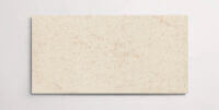 A single sand colored terrazzo marble tile