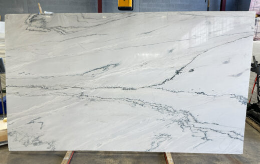 Nasco Stone + Tile 134" x 79" White Macabus Quartzite slab.