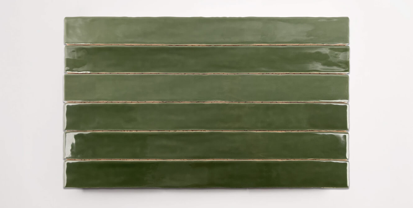 Six stacked 2" x 20" ceramic tiles in a dark green color