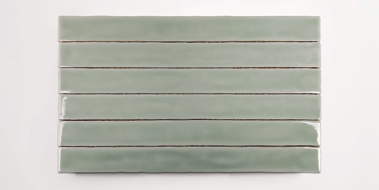 Six stacked 2" x 20" ceramic tiles in a light green color