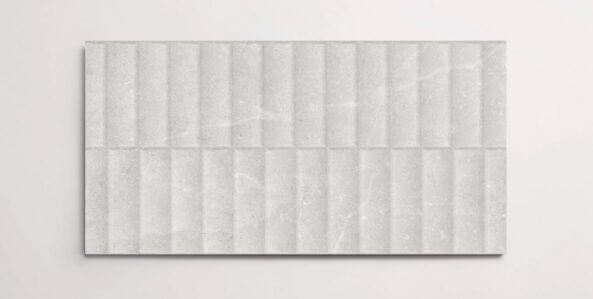 A single white 10" x 30" stone-like porcelain tile with a textured blind pattern and subtle veining