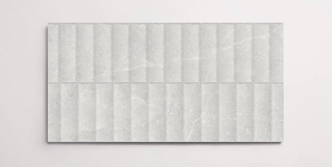 A single white 10" x 30" stone-like porcelain tile with a textured blind pattern and subtle veining