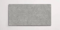 A single grey 10" x 30" porcelain tile resembling stone with a textured finish