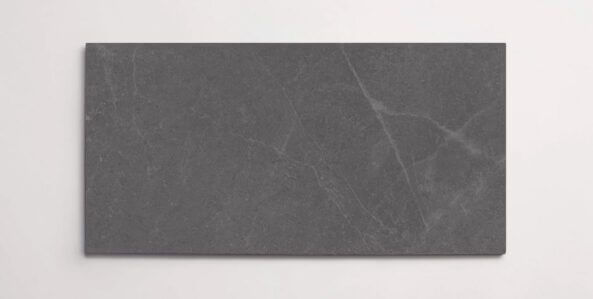 A single dark grey 10" x 30" stone-like porcelain tile with subtle veining