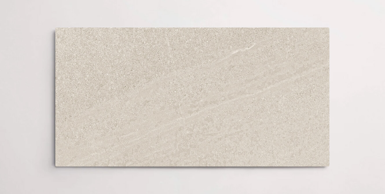 Nasco Stone + Tile 24" x 48" Newen Ivory porcelain tile.