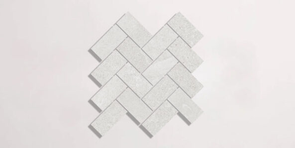 Nasco Stone + Tile Newen White Herringbone Mosaic porcelain tile.